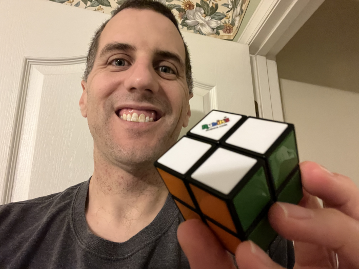 Andrew with solved 2x2 Rubiks Cube